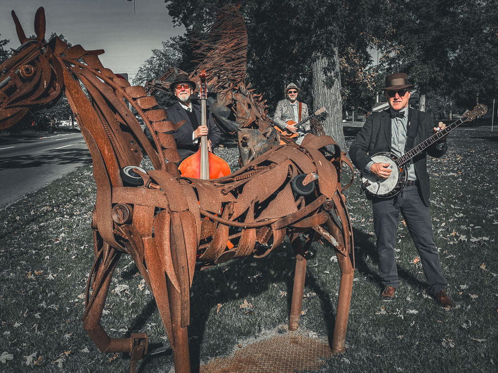 Detroit event band The Thrift Shop Cowboys performing acoustic cover songs with upright bass at an outdoor venue